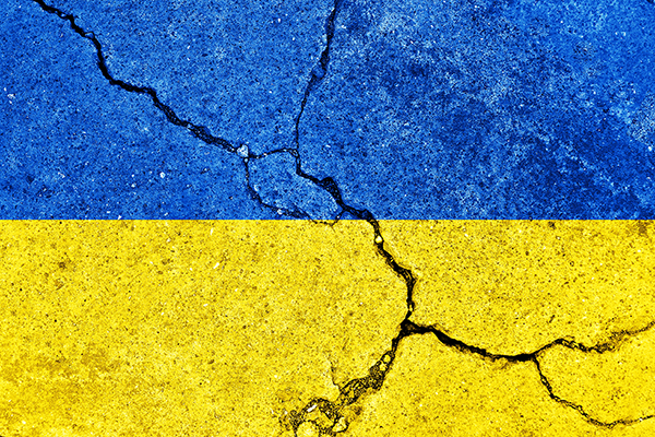 Ukrainian flag colours overlayed on cracked concrete